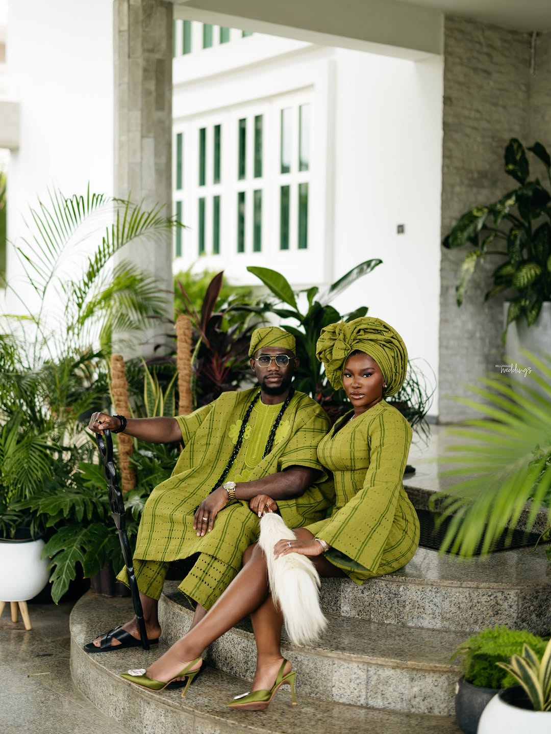 A Nigerian couple during a coordinated pre-wedding photo shoot, the bride looking towards her partner in soft natural light